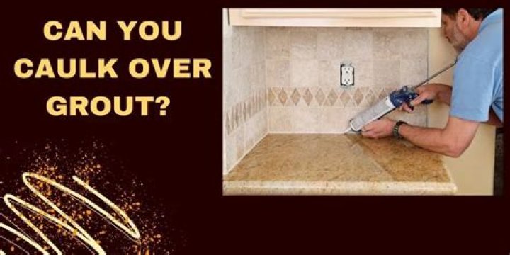 Can you caulk over grout?