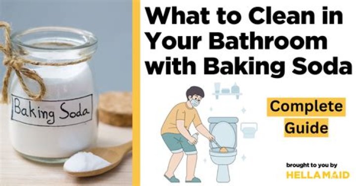 How do you clear a clogged bathroom with baking soda and vinegar?