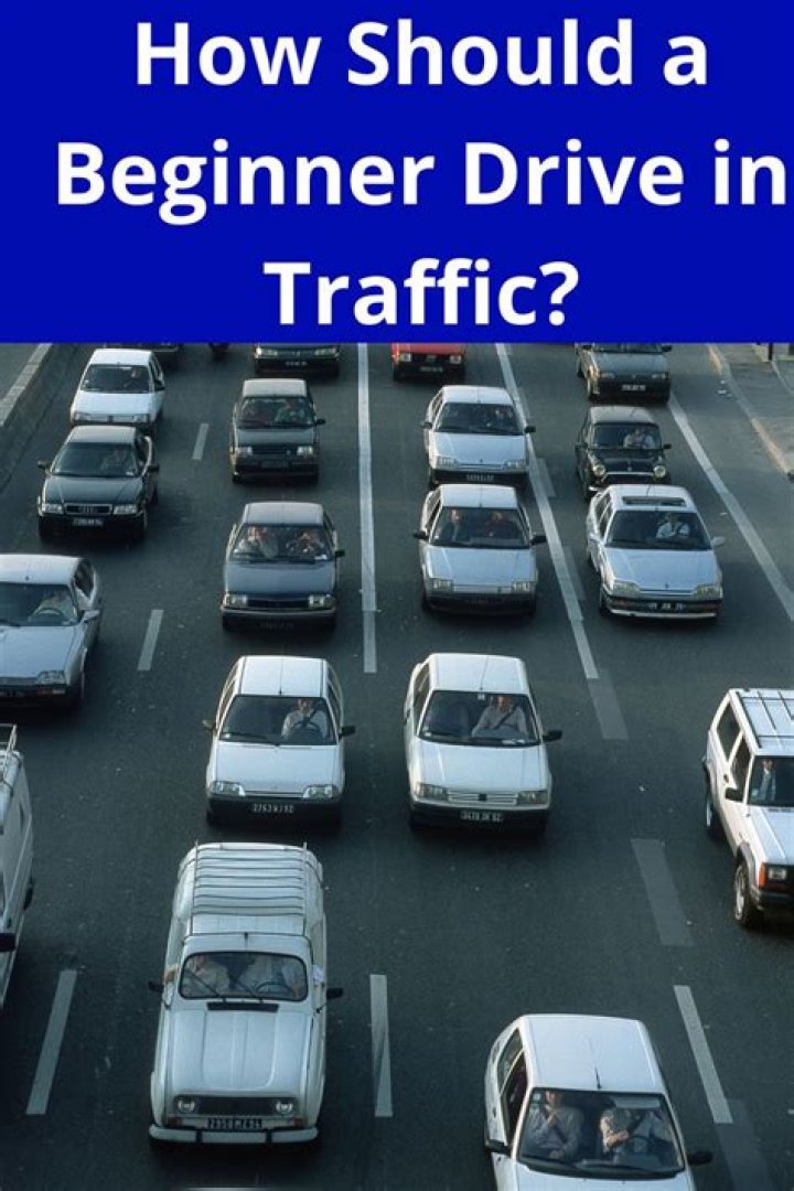 How should a beginner drive in traffic?