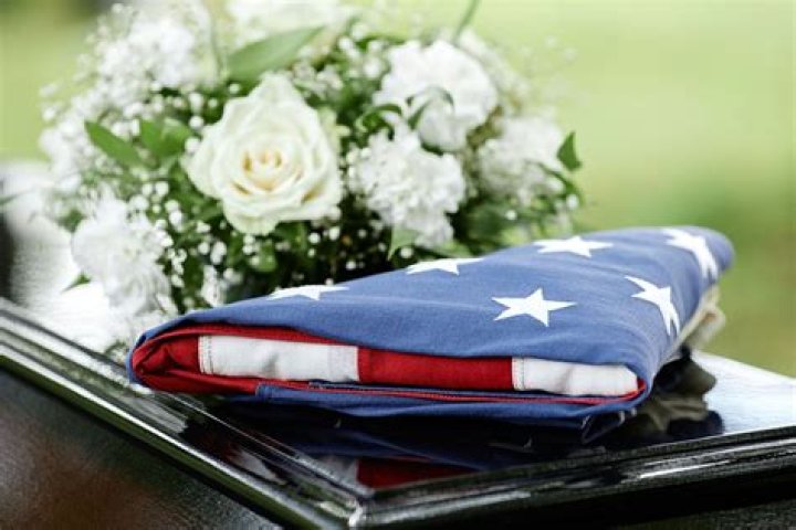 Who gets the folded flag at a military funeral?