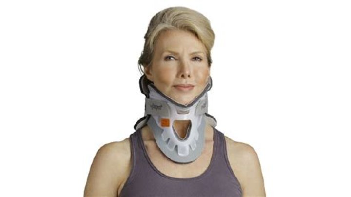 Why is Coraline's mom wearing a neck brace?